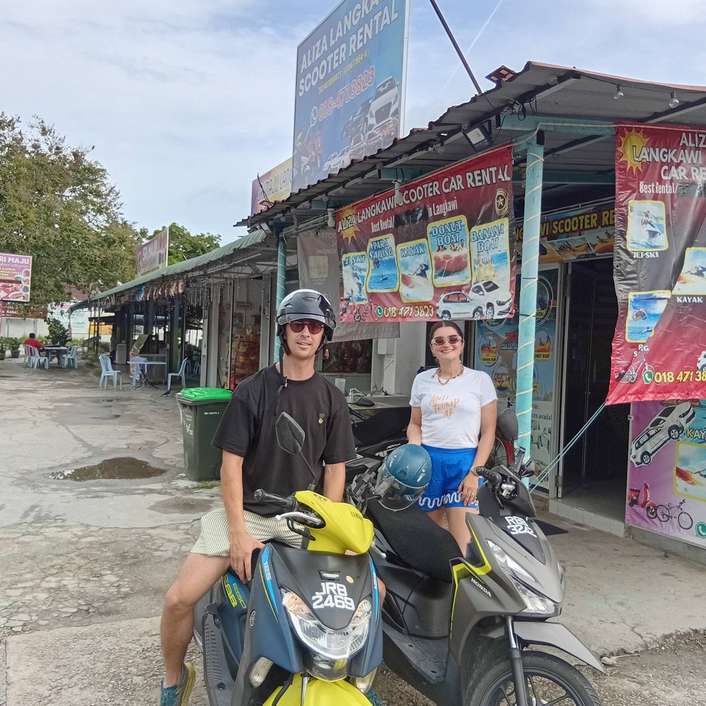 Couple on rental scooters at the Aliza shop